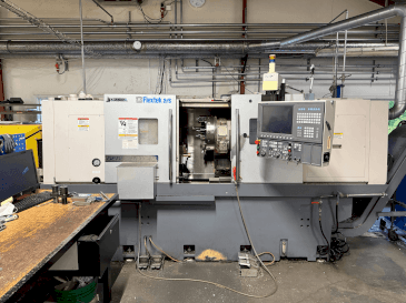 A Okuma Genos L300E-M with FMB Turbo 8-80  gép elölnézete